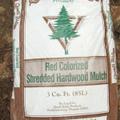 Red colorized mulch in bag