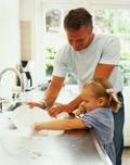 Father and Daughter washing dishes
