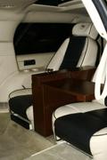custom leather rear seats and leather panels with hand crafted wood console