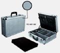 Aluminum case made from assembled aluminum. EVA dividers, tool pouch in lid and cubed foam in base.