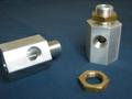 Aluminum and brass mating parts