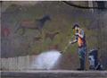 Street cleaner hosing away cave paintings
